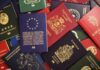 Various colorful international passports spread out.