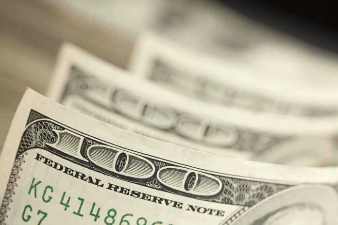 120456253 featured image Close-up of hundred-dollar bills.