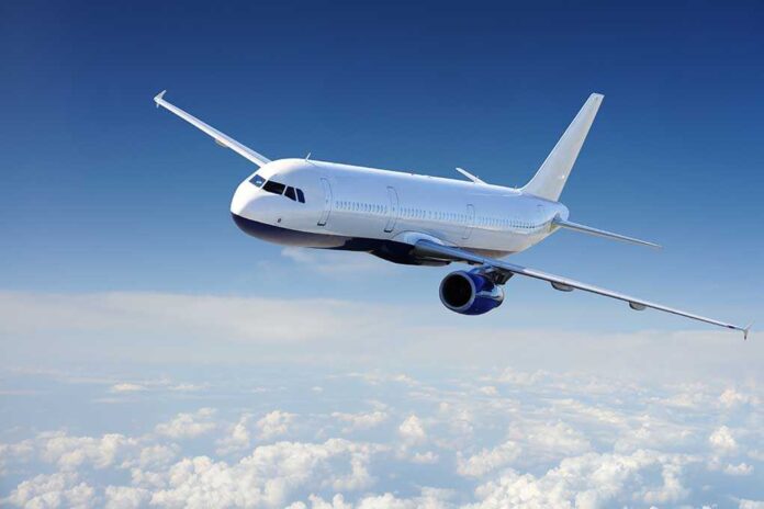 41347264 featured image Airplane flying above fluffy white clouds sky