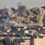 Smoke rising from buildings after an explosion