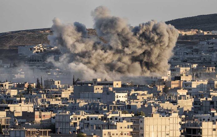357175997 featured image Smoke rising from buildings after an explosion