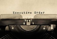 Copywriter with executive order typed out