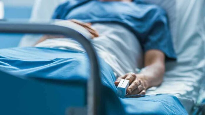 1190997985 featured image Person lying in hospital bed with monitor attached