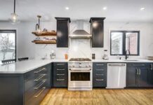 Modern kitchen with black cabinets and marble countertops