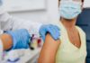 Woman receiving a shot in the arm