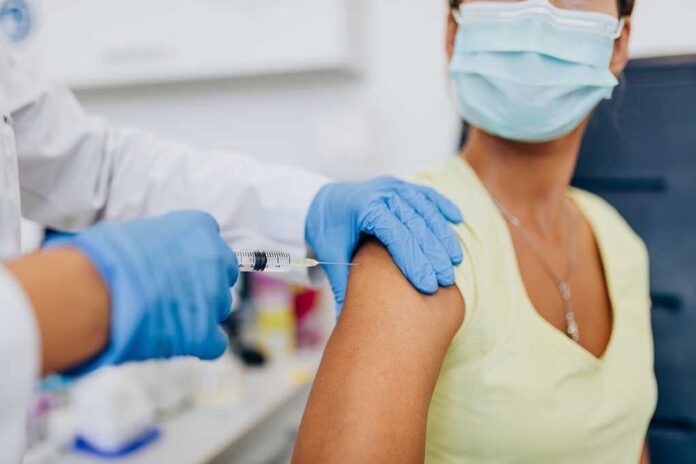 1789303814 featured image Woman receiving a shot in the arm