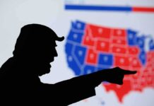 Silhouette pointing at a U.S. electoral map.