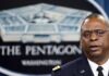 Man speaking in front of Pentagon sign