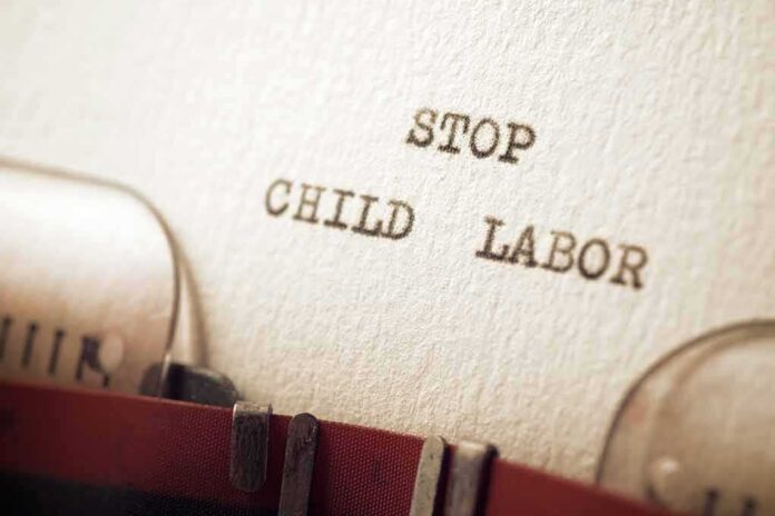 2074595140 featured image Typewriter message says stop child labor