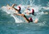 Group of swimmers racing in open water