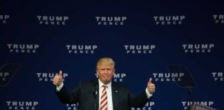 Man giving thumbs up at a Trump Pence rally