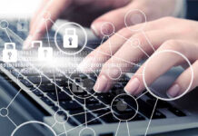 Hands typing with cybersecurity icons overlay.