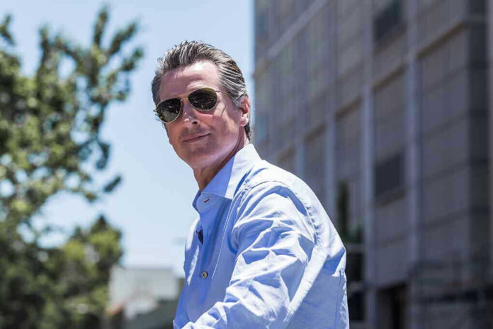 Man in sunglasses wearing a blue button up shirt
