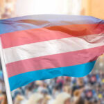 FTC BOMBSHELL: Gender Clinics Under Federal Fire Transgender pride flag waving at outdoor event