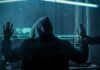 Hacker in hoodie arrested at computer desk