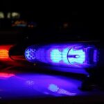 Close up of police lights flashing in blue and red at night