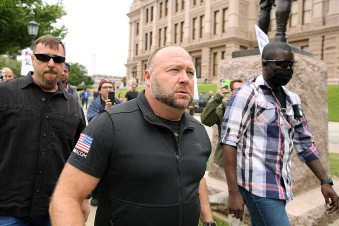 Group of people walking outside a large building.