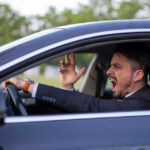 Road Rage Madness: Shocking Attack Leaves Man Blind Man yelling inside a car, looking frustrated.