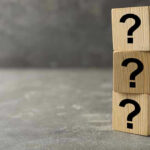6 Candidate Deaths: SHOCKING Pattern Emerges Three wooden blocks with black question marks stacked.