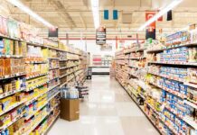 A grocery store aisle filled with various food products on shelves