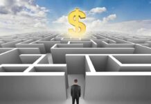 A man in a suit standing at the entrance of a maze with a dollar sign above