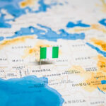 Flag pin marking Nigeria on Africa map