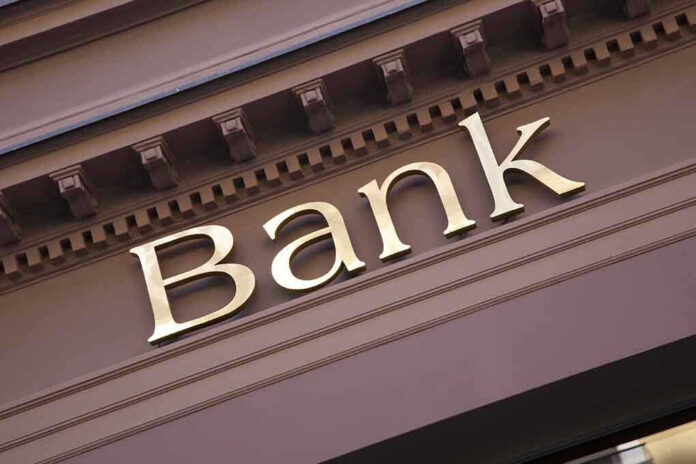 Bank sign on building facade.