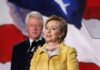 Clintons’ CONTEMPT: NO Place to HIDE Hillary Clinton delivering a speech with Bill Clinton in the background