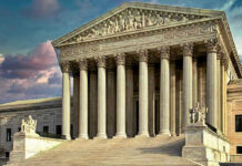 Supreme Court Stuns Trump’s Powers Building with columns and statues in front of entrance.