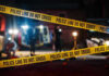 Navy Reservist Freezer Horror Yellow police tape in front of crime scene.