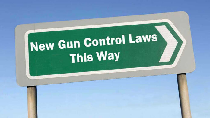 326968181 Sign: New Gun Control Laws This Way with arrow.