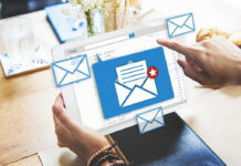 Tablet displaying email inbox with notifications icon