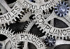 Gears labeled: rules, regulations, compliance, standards, policies.