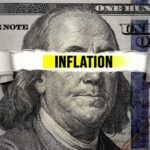 FINALLY: Inflation Plummets — What This Means to YOU A torn paper strip with the word INFLATION over a hundred dollar bill featuring Benjamin Franklin