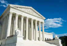 Supreme Court Crushes $1B Piracy Shakedown Building with columns under a blue sky.