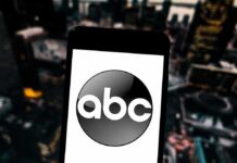 FBI Publicly Shames ABC With Side-by-Side Proof A smartphone displaying the ABC logo against a blurred urban background