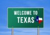 Welcome to Texas road sign with a Texas map