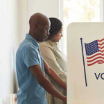 SHOCKING Billionaire Tax to Hit The BALLOT — 1.5M Signatures SECURED People voting at polling booths with American flag.