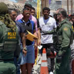“GOTAWAYS” Surge Sparks MASSIVE Scramble Border patrol agents inspecting group of individuals in line.