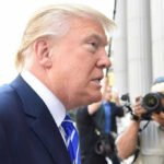 Pope Strikes Back — Trump Rage Goes Nuclear Man in suit with photographers in background.