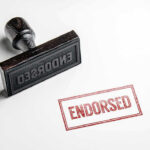 Trump UNLEASHES ENDORSEMENT Plan — GOP Shocked Rubber stamp with ENDORSED text on paper.