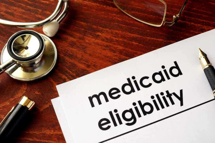 Stethoscope pen document about Medicaid eligibility on table
