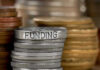 Stack of coins labeled funding with other coins stacks