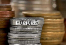 Stack of coins labeled funding with other coins stacks
