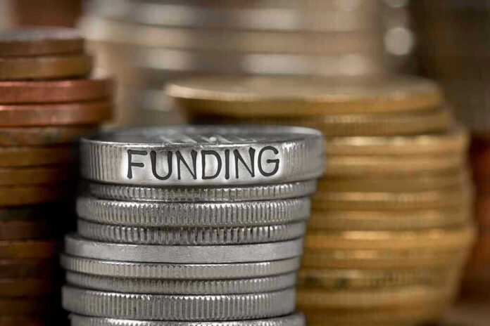 Stack of coins labeled funding with other coins stacks