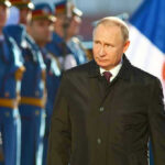 Russia Posts European “Targets”–SHOCKING LIST A man in dark coat at a military event.