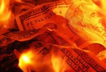 $2 Trillion Regulatory Hit—Who Pays? Burning U.S. dollar bills surrounded by flames