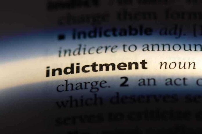 Close-up of a dictionary page showing the definition of 'indictment'