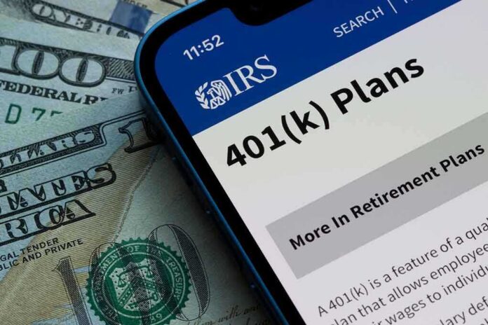 Mobile phone displaying IRS information about 401(k) plans on a background of cash