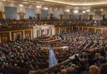 Senate Showdown: INSIDIOUS BANKING Rules REJECTED Large assembly in a government legislative chamber.